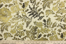 Load image into Gallery viewer, This fabric features a metallic threaded floral design in gold and black. 
