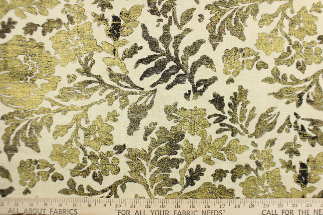 This fabric features a metallic threaded floral design in gold and black. 