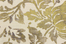 Load image into Gallery viewer, This fabric features a metallic threaded floral design in gold with black and gray tones .
