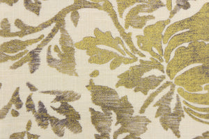 This fabric features a metallic threaded floral design in gold with black and gray tones .
