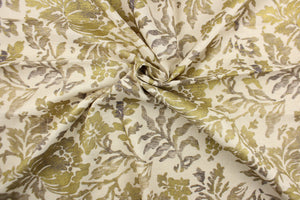 This fabric features a metallic threaded floral design in gold with black and gray tones .