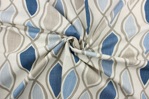 This fabric features a geometric design in blue, gray, taupe, and natural. 