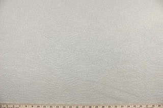  Billow is a multi use textured jacquard fabric in solid light silvery gray.  It is durable with 39,000 double rubs and would be great for light upholstery, bedding, cornice boards, accent pillows and window treatments.