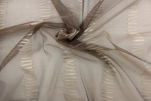 This sheer fabric features a stripe design in a rich brown.
