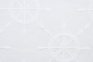 Ships Wheel matelassé fabric in chalk white features a captain's wheel design.  It is durable with 15,000 double rubs and would be great for upholstery, bedding, cornice boards, accent pillows and window treatments.