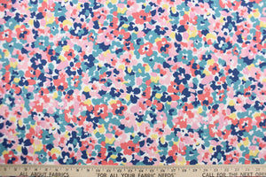 This Solarium outdoor decorative print features a floral design in pink, blue, turquoise, yellow and red on a white background.  This versatile, long-lasting fabric can withstand up to 500 hours of sunlight, water and stain resistant and has 10,000 double rubs.  It is perfect for lounge cushions, pool furniture, tablecloths, decorative pillows and upholstery projects.  This fabric has a slightly stiff feel but is easy to work with.  