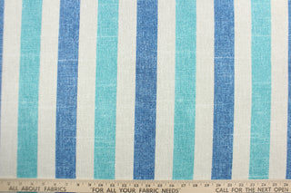 This Solarium outdoor decorative print features stripes in denim blue, teal and linen.  This versatile, long-lasting fabric can withstand up to 500 hours of sunlight, water and stain resistant and has 10,000 double rubs.  It is perfect for lounge cushions, pool furniture, tablecloths, decorative pillows and upholstery projects.  This fabric has a slightly stiff feel but is easy to work with.  