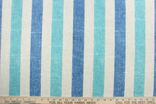 Load image into Gallery viewer, This Solarium outdoor decorative print features stripes in denim blue, teal and linen.  This versatile, long-lasting fabric can withstand up to 500 hours of sunlight, water and stain resistant and has 10,000 double rubs.  It is perfect for lounge cushions, pool furniture, tablecloths, decorative pillows and upholstery projects.  This fabric has a slightly stiff feel but is easy to work with.  
