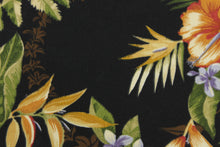 Load image into Gallery viewer, This Solarium outdoor decorative print features a large tropical floral design in the colors of beige, tan, green, brown, orange and purple on a black background. This versatile, long-lasting fabric can withstand up to 500 hours of sunlight, water and stain resistant and has 10,000 double rubs.  It is perfect for lounge cushions, pool furniture, tablecloths, decorative pillows and upholstery projects.  This fabric has a slightly stiff feel but is easy to work with.  
