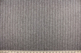 This multi purpose fabric is a neutral dark grey faux wool with a brown stripe.  It offers beautiful design, style and color to any space in your home.  It has a soft workable feel and is durable with 50,000 double rubs.  Perfect for window treatments (draperies, valances, curtains, and swags), upholstery, cornice boards, accent pillows and home décor.
