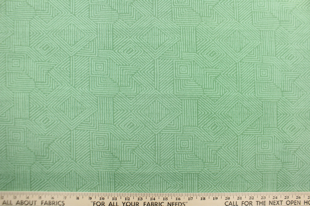 This Solarium outdoor decorative print features a geometric design in green.  This versatile, long-lasting fabric can withstand up to 500 hours of sunlight, water and stain resistant and has 10,000 double rubs.  It is perfect for lounge cushions, pool furniture, tablecloths, decorative pillows and upholstery projects.  This fabric has a slightly stiff feel but is easy to work with.  