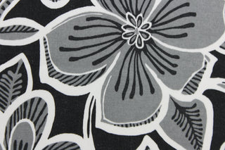 This Solarium outdoor decorative print features a large floral design in black, white and gray.  This versatile, long-lasting fabric can withstand up to 500 hours of sunlight, water and stain resistant and has 10,000 double rubs.  It is perfect for lounge cushions, pool furniture, tablecloths, decorative pillows and upholstery projects.  This fabric has a slightly stiff feel but is easy to work with.  