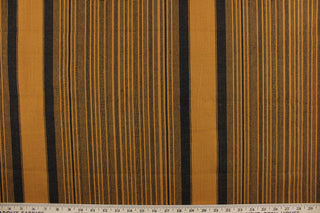 This multi purpose woven fabric features a multi width stripe design in golden brown and black.  It offers beautiful design, style and color to any space in your home.  It has a slightly stiff feel but is workable and durable.  Perfect for window treatments (draperies, valances, curtains, and swags), upholstery, cornice boards, accent pillows and home décor.