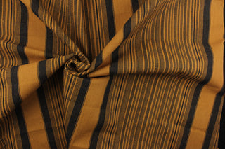 This multi purpose woven fabric features a multi width stripe design in golden brown and black.  It offers beautiful design, style and color to any space in your home.  It has a slightly stiff feel but is workable and durable.  Perfect for window treatments (draperies, valances, curtains, and swags), upholstery, cornice boards, accent pillows and home décor.