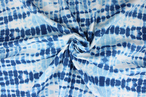  This Solarium outdoor print features a tie die design in blue and white.  This versatile, long-lasting fabric can withstand up to 500 hours of sunlight, water and stain resistant and has 10,000 double rubs.  It is perfect for lounge cushions, pool furniture, tablecloths, decorative pillows and upholstery projects.  This fabric has a slightly stiff feel but is easy to work with.  Bring indoors when not in use. 