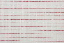 Load image into Gallery viewer, This multi purpose fabric features a woven half inch red stripe against an off white background.  It offers beautiful design, style and color to any space in your home.  It has a soft workable feel and is durable with 51,000 double rubs and has a soil and stain resistant finish.  Perfect for window treatments (draperies, valances, curtains, and swags), upholstery, cornice boards, accent pillows and home décor.
