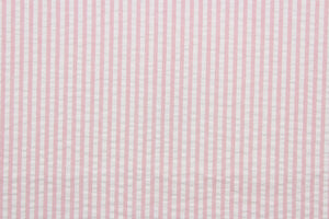 This multi purpose fabric features a classic seersucker stripe in pink and white and offers beautiful design, style and color to any space in your home.  It has a soft workable feel and is durable with 21,000 double rubs.  Perfect for window treatments (draperies, valances, curtains, and swags), upholstery,  bed skirts and accent pillows.  