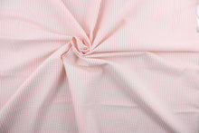 Load image into Gallery viewer, This multi purpose fabric features a classic seersucker stripe in pink and white and offers beautiful design, style and color to any space in your home.  It has a soft workable feel and is durable with 21,000 double rubs.  Perfect for window treatments (draperies, valances, curtains, and swags), upholstery,  bed skirts and accent pillows.  
