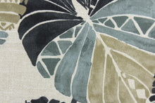 Load image into Gallery viewer, This Solarium outdoor decorative print features a large tropical leaf design in black, taupe and gray.  This versatile, long-lasting fabric can withstand up to 500 hours of sunlight, water and stain resistant and has 10,000 double rubs.  It is perfect for lounge cushions, pool furniture, tablecloths, decorative pillows and upholstery projects.  This fabric has a slightly stiff feel but is easy to work with.  
