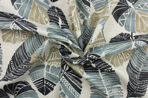 This Solarium outdoor decorative print features a large tropical leaf design in black, taupe and gray.  This versatile, long-lasting fabric can withstand up to 500 hours of sunlight, water and stain resistant and has 10,000 double rubs.  It is perfect for lounge cushions, pool furniture, tablecloths, decorative pillows and upholstery projects.  This fabric has a slightly stiff feel but is easy to work with.  