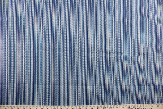 This multi purpose fabric features a striped design in shades of blue and light beige.  It offers beautiful design, style and color to any space in your home.  It has a soft workable feel and is durable with 18,000 double rubs.  Perfect for window treatments (draperies, valances, curtains, and swags), upholstery, bed skirts, accent pillows and home décor.