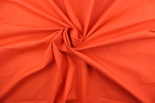 Load image into Gallery viewer, This beautiful solid orange fabric has a smooth and lustrous appearance.  The  fabric offers a crisp hand and a stiff but flexible drape.  The glossy finish makes it great for apparel, drapery lining and much more.   
