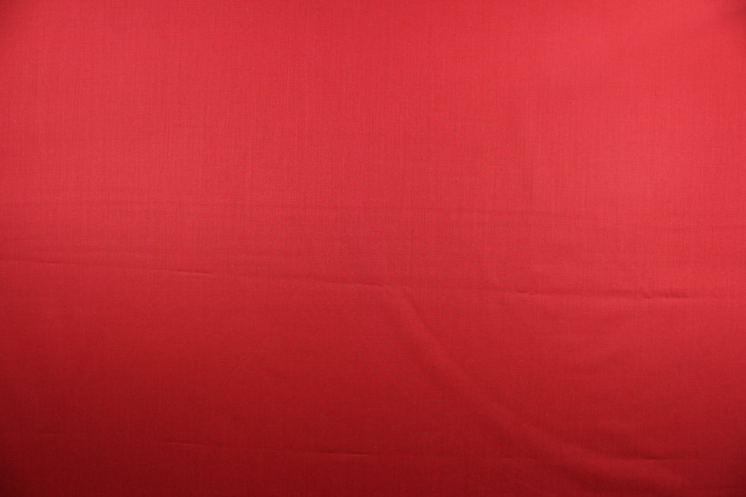 This beautiful solid red fabric has a smooth and lustrous appearance.  The  fabric offers a crisp hand and a stiff but flexible drape.  The glossy finish makes it great for apparel, drapery lining and much more.   