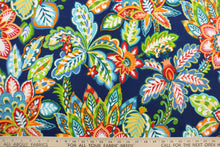 Load image into Gallery viewer, This Solarium outdoor decorative print features a large floral design in  red, green, yellow, white, orange and blue.  This versatile, long-lasting fabric can withstand up to 500 hours of sunlight, water and stain resistant and has 10,000 double rubs.  It is perfect for lounge cushions, pool furniture, tablecloths, decorative pillows and upholstery projects.  This fabric has a slightly stiff feel but is easy to work with.  
