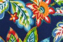 Load image into Gallery viewer, This Solarium outdoor decorative print features a large floral design in  red, green, yellow, white, orange and blue.  This versatile, long-lasting fabric can withstand up to 500 hours of sunlight, water and stain resistant and has 10,000 double rubs.  It is perfect for lounge cushions, pool furniture, tablecloths, decorative pillows and upholstery projects.  This fabric has a slightly stiff feel but is easy to work with.  
