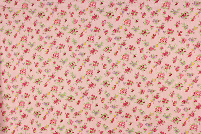 This beautiful rose and leaves print in  purple, deep pink, green, and yellow against  a pink with white polka dot background is a great fabric for quilting, bedding, clothing, pin cushions, crafting and home décor, etc.