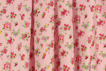 Load image into Gallery viewer, This beautiful rose and leaves print in  purple, deep pink, green, and yellow against  a pink with white polka dot background is a great fabric for quilting, bedding, clothing, pin cushions, crafting and home décor, etc.
