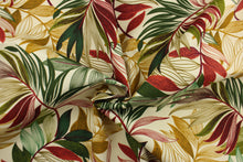 Load image into Gallery viewer, This Solarium outdoor decorative print features a large tropical leaf design in red, green and tan on a beige background.  This versatile, long-lasting fabric can withstand up to 500 hours of sunlight, water and stain resistant and has 10,000 double rubs.  It is perfect for lounge cushions, pool furniture, tablecloths, decorative pillows and upholstery projects.  This fabric has a slightly stiff feel but is easy to work with.  

