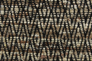 Tangier is a chenille high end upholstery weight fabric that contains thick and soft yarns to create a durable fabric.  Featuring a geometric, diamond, tribal design in brown, beige and black, it would be great for upholstery projects including sofas, chairs, dining chairs, pillows, throws, handbags and craft projects.  