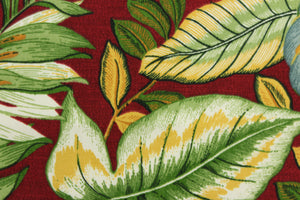 This Solarium outdoor print features a large tropical leaf design in blue, yellow, white and green on a berry red background.  This versatile, long-lasting fabric can withstand up to 500 hours of sunlight, water and stain resistant and has 10,000 double rubs.  It is perfect for lounge cushions, pool furniture, tablecloths, decorative pillows and upholstery projects.  This fabric has a slightly stiff feel but is easy to work with.  