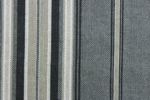 This Solarium outdoor print features a striped design in black, gray, white and khaki.  This versatile , long-lasting fabric can withstand up to 500 hours of sunlight, water and stain resistant and has 10,000 double rubs.  It is perfect for lounge cushions, pool furniture, tablecloths, decorative pillows and upholstery projects.  Bring indoors when not in use. 