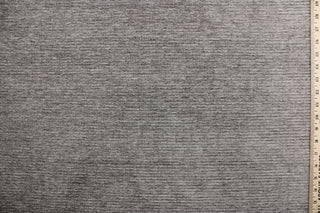  Moraine is a grayish brown chenille high end upholstery weight fabric that is suited for uses that requires a more durable fabric.  The reinforced backing makes it great for upholstery projects including sofas, chairs, dining chairs, pillows, handbags and craft projects.  It is soft and pliable and would make a great accent to any room.  