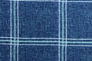 This solarium outdoor print features a plaid design with white and blue green stripes against a denim blue background.  It is durable and can withstand up to 500 hours of sunlight, water and stain resistant and has 10,000 double rubs.  It is perfect for cushions, tablecloths, decorative pillows and upholstery projects.  Bring indoors when not in use.  We offer this fabric in other colors.