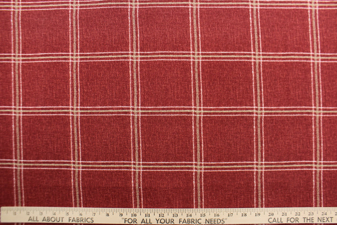This solarium outdoor print features a plaid design with white and khaki stripes against a berry background.  It is durable and can withstand up to 500 hours of sunlight, water and stain resistant and has 10,000 double rubs.  It is perfect for cushions, tablecloths, decorative pillows and upholstery projects.  Bring indoors when not in use.