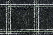 Load image into Gallery viewer, This solarium outdoor print features a plaid design with white and light green stripes against a black background.  It is durable and can withstand up to 500 hours of sunlight, water and stain resistant and has 10,000 double rubs.  It is perfect for cushions, tablecloths, decorative pillows and upholstery projects.  Bring indoors when not in use.
