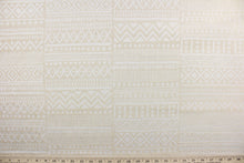 Load image into Gallery viewer,  Bamako Stripe is a chenille high end upholstery weight fabric that is suited for uses that requires a more durable fabric.  Featuring an Aztec design in sand and antique white it would be great for upholstery projects including sofas, chairs, dining chairs, pillows, handbags and craft projects.  It is soft and durable with 51,000 double rubs and offers a soil and stain repellant finish.
