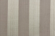 Load image into Gallery viewer, This stunning yarn dyed fabric features a  wide striped pattern in a slivery gray and taupe. 
