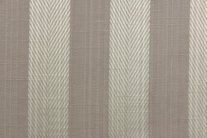 This stunning yarn dyed fabric features a  wide striped pattern in a slivery gray and taupe. 