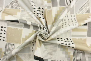 This fabric features a unique design in beige, gray, black and dull white .