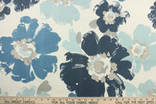 Load image into Gallery viewer, This fabric features a floral design in varying shades of blue and gray against a dull white background . 

