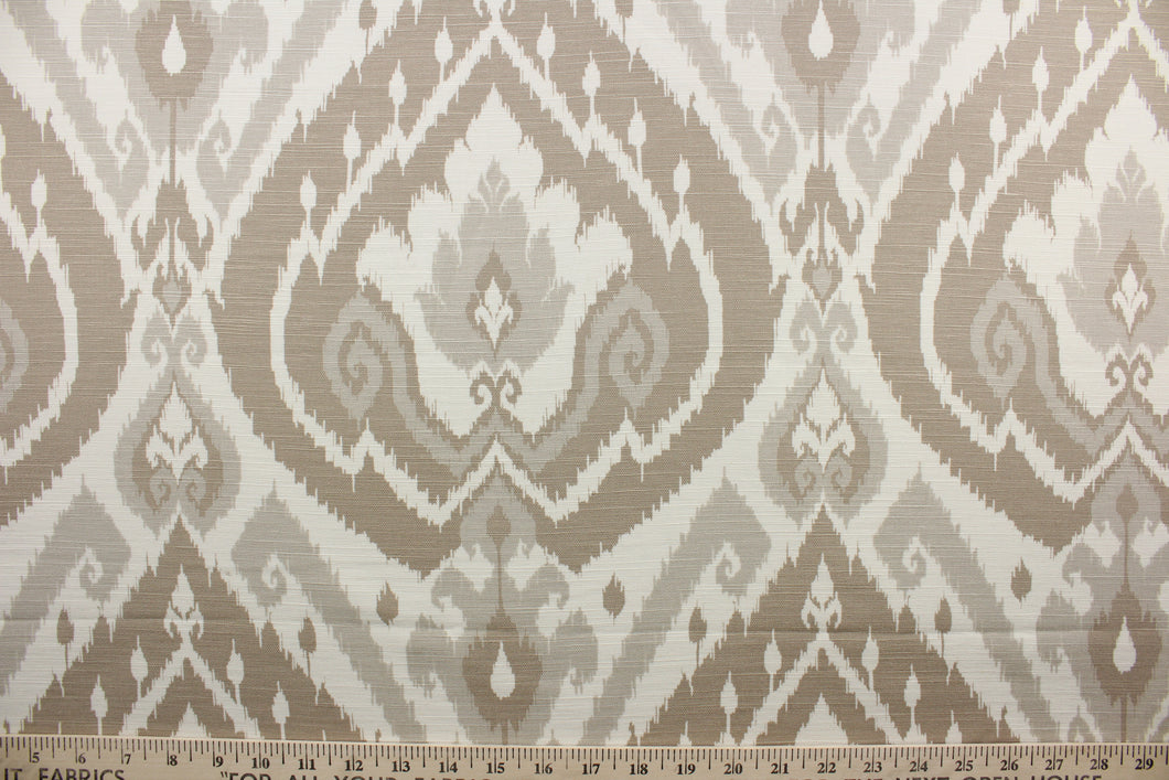 Lima is a multi-use fabric that blends cotton, linen and rayon for a luxurious and soft feel.  Its classic damask print comes in a light grey and shades of beige and has a durability of 15,000 double rubs.  The versatile fabric is perfect for window accents (draperies, valances, curtains and swags) cornice boards, accent pillows, bedding, headboards, cushions, ottomans, slipcovers and light duty upholstery.  