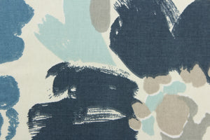 This fabric features a floral design in varying shades of blue and gray against a dull white background . 