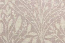 Load image into Gallery viewer, This fabric features a leaf design in a pale purple and dull white.
