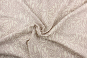 This fabric features a leaf design in a pale purple and dull white.