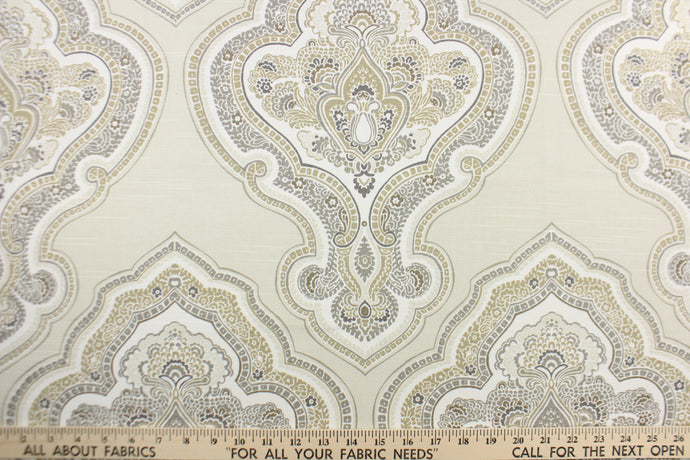  This fabric features a paisley demask design in white, gray, beige, brown and off white 
