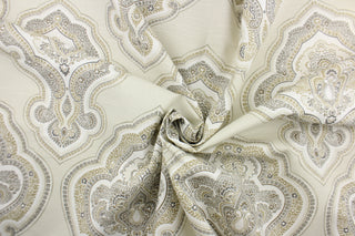  This fabric features a paisley demask design in white, gray, beige, brown and off white 